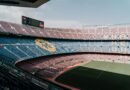 View of Camp Nou stadium in Barcelona, showcasing the iconic stands and field.